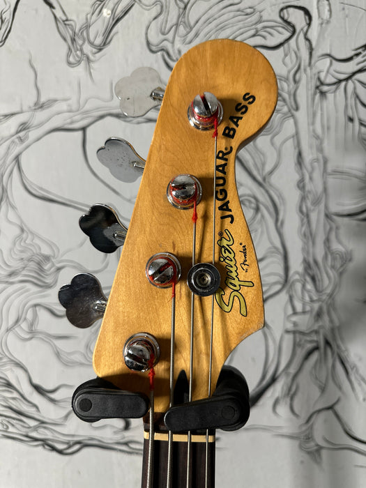 Squier Jaguar Bass Crimson Red Transparent