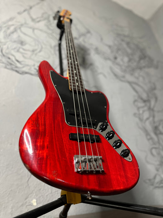 Squier Jaguar Bass Crimson Red Transparent